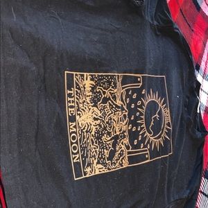 an oversized tee size small , the image is of 2 dogs howling at the moon